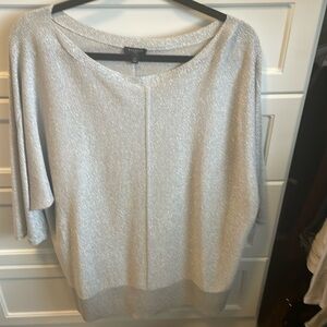 Silver shimmery sweater with 3/4 sleeves.